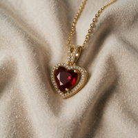 Heart-shaped gold and ruby pendant necklace
