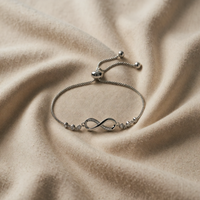 Sliding bracelet with infinity symbol in white gold